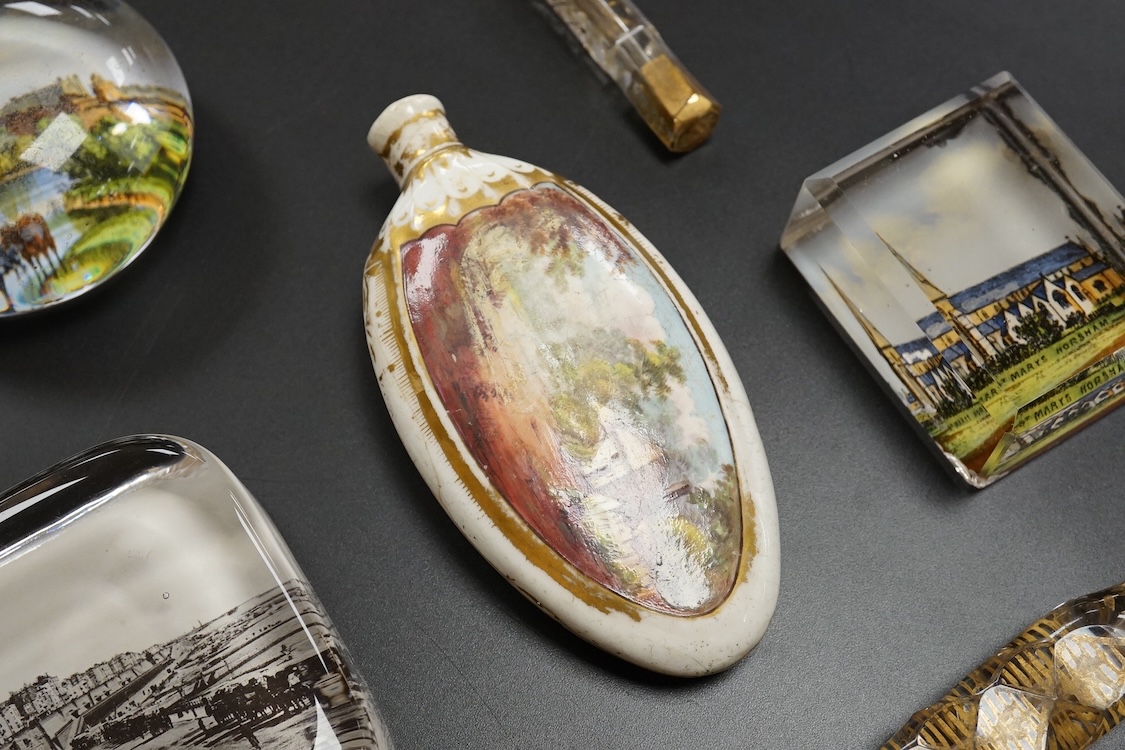 Six pictorial glass gem paperweights and three 19th century scent bottles, largest 11cm in length